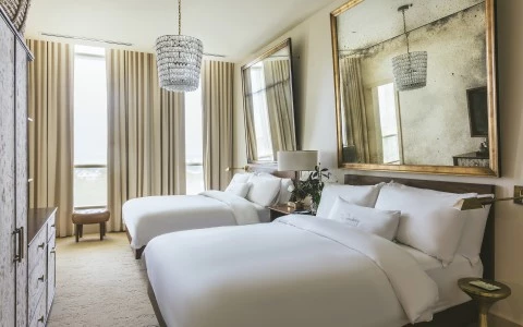 a bedroom with a large mirror