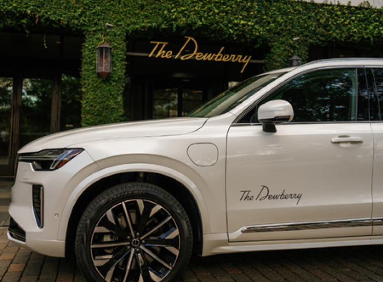 a white car parked in front of a building