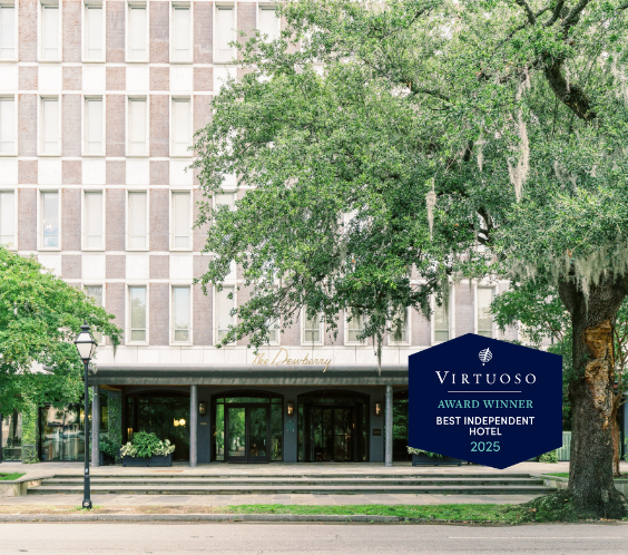 a building with trees and a sign