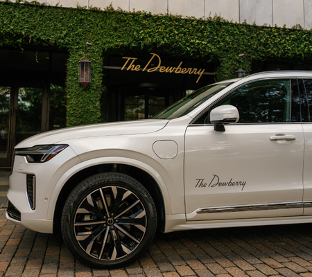 a white car parked in front of a building