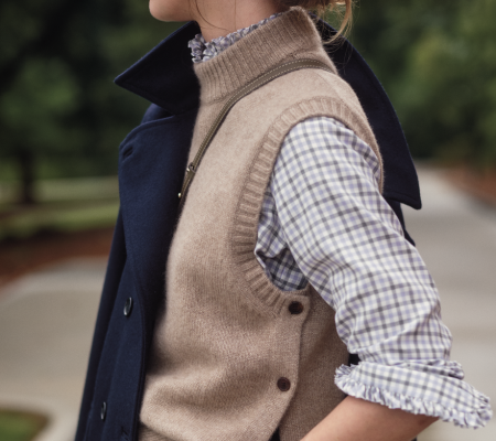 a woman in a vest