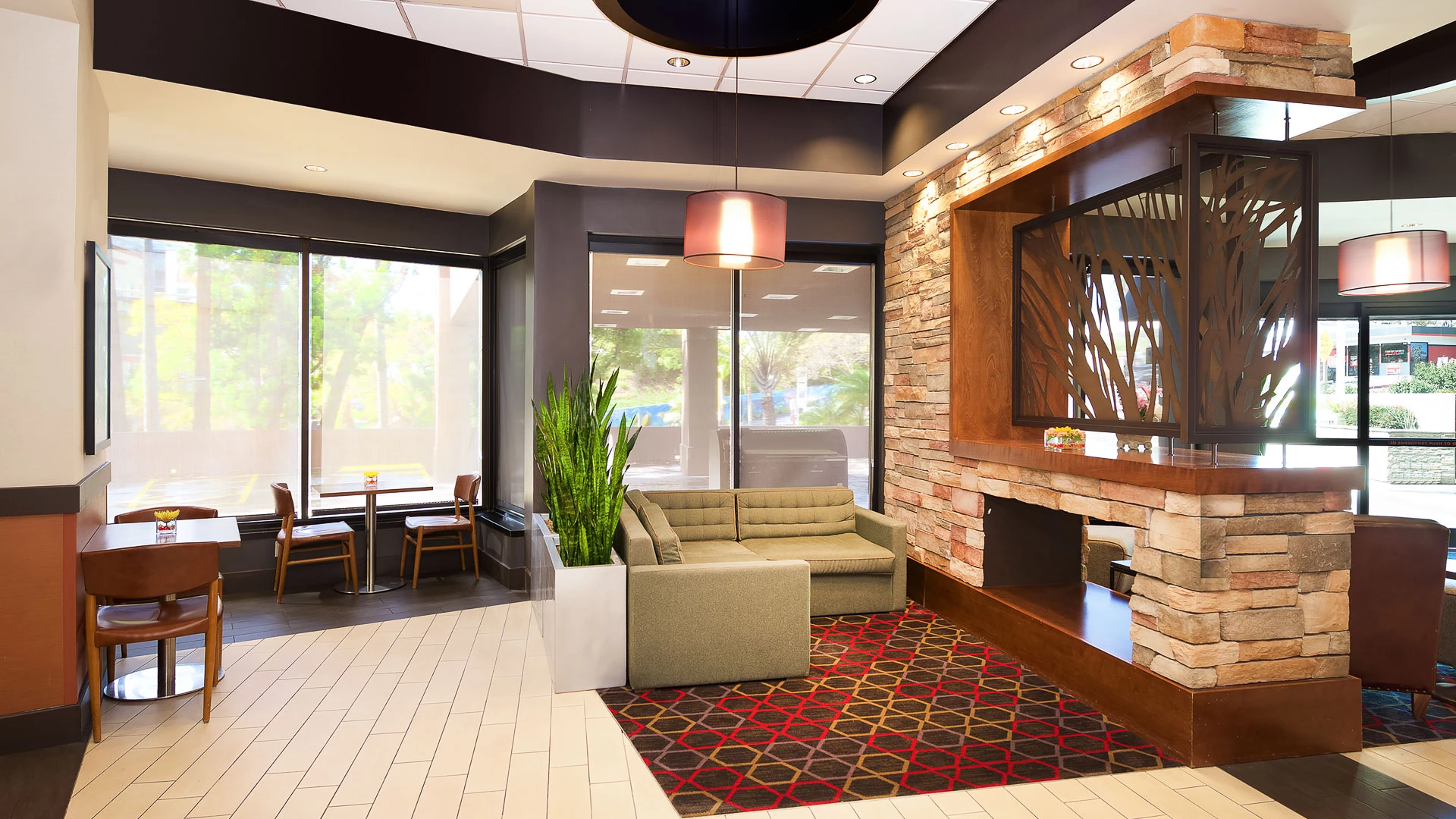 a room with a couch and a fireplace