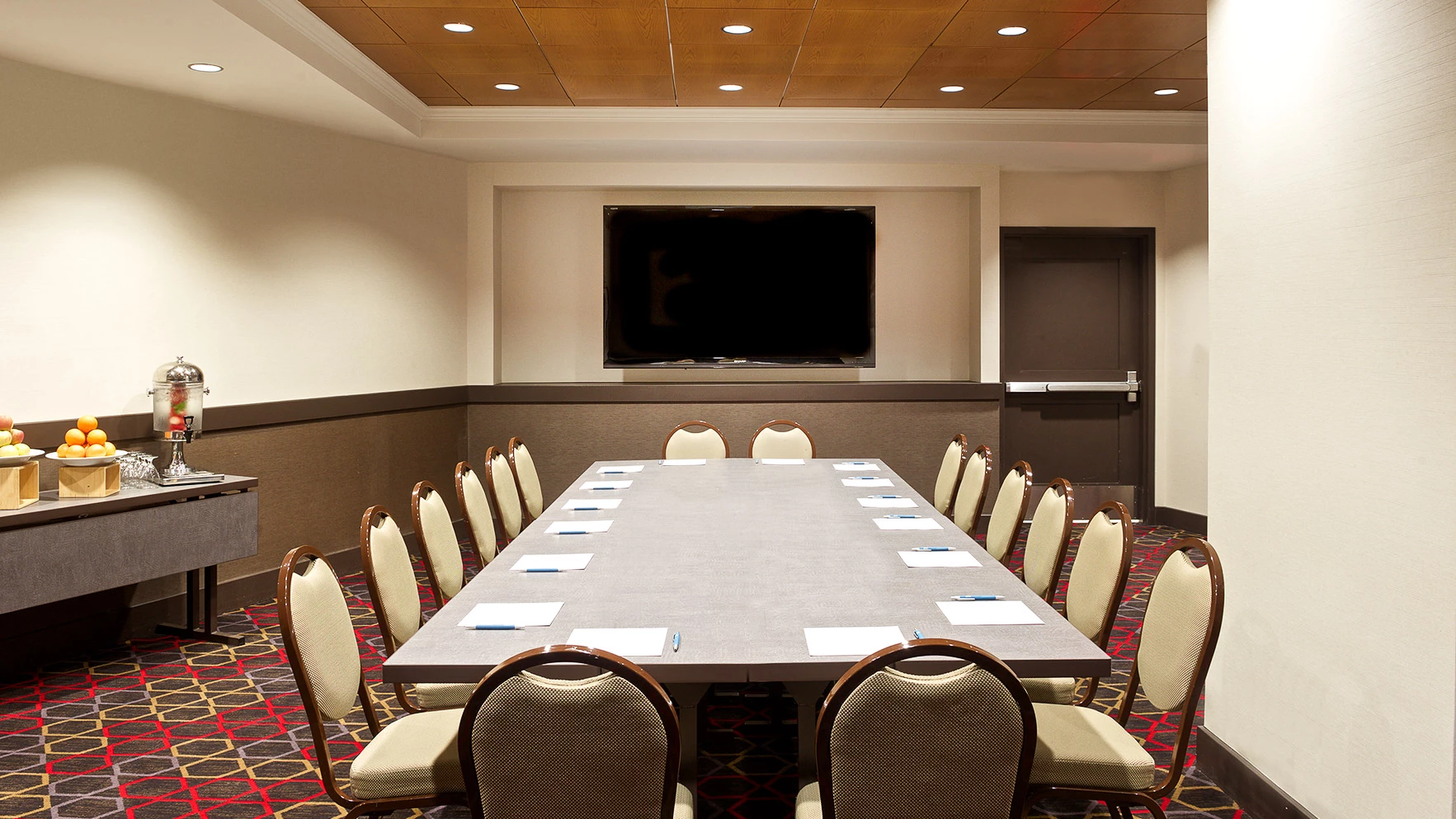 a conference room with a table and chairs