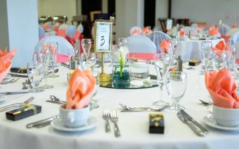 wedding table set up with hints of coral