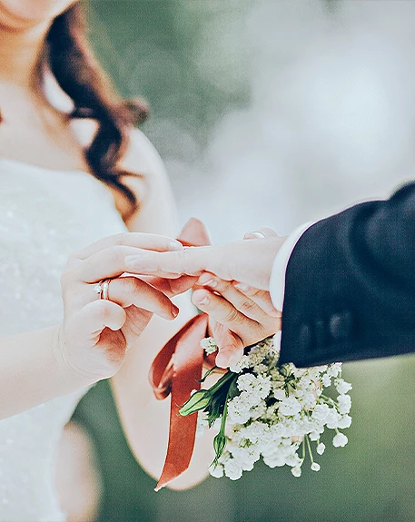bride and groom exchanging rings