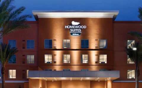 a building with palm trees in front of it