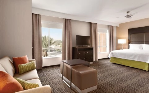 a bedroom with a large window