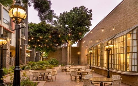 a courtyard with tables and chairs