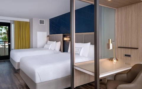 a hotel room with two beds