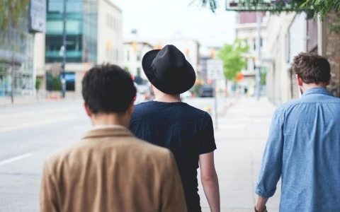 a group of people walking down a street