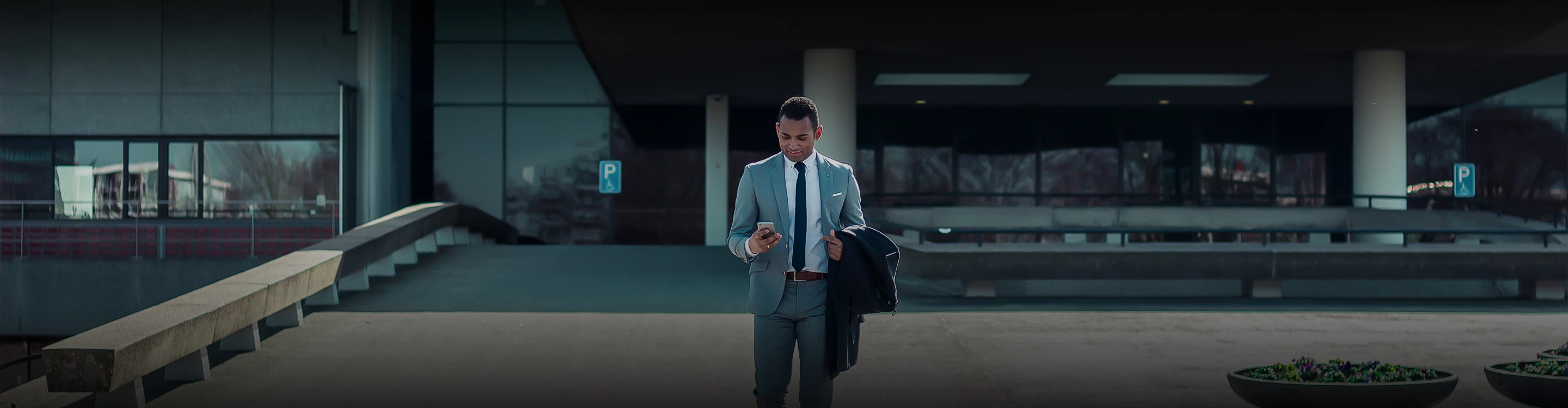 a man standing in front of a building