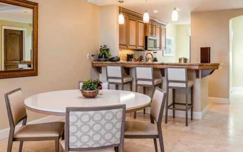 a kitchen with a dining table