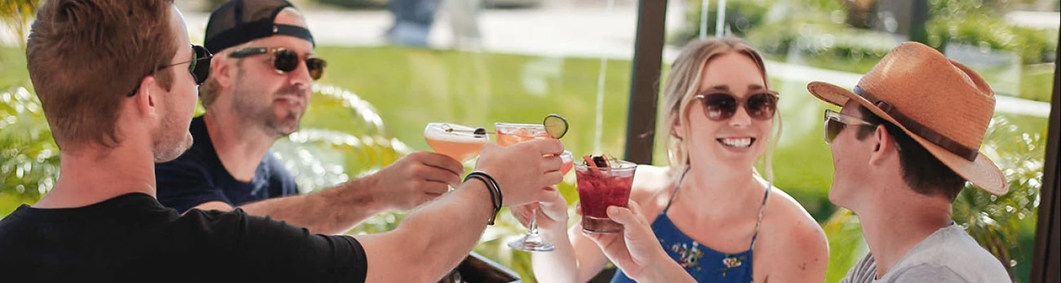 a group of people holding drinks