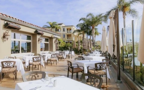 a patio with tables and chairs