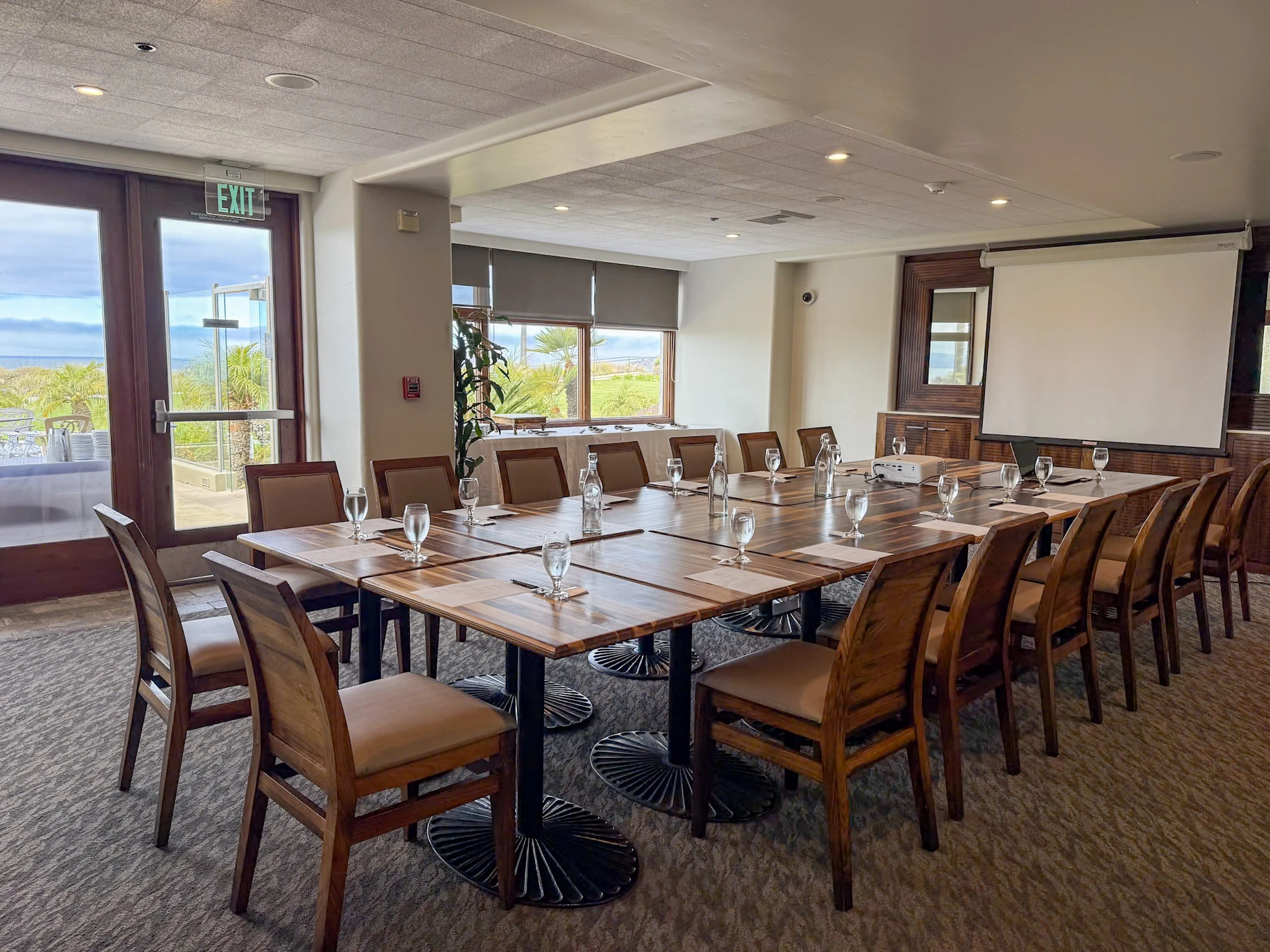 Coastal Room at Dolphin Bay Resort & Spa in Pismo Beach — elegant meeting and dining space for up to 30 guests, featuring partial ocean views and full audio-visual capabilities.