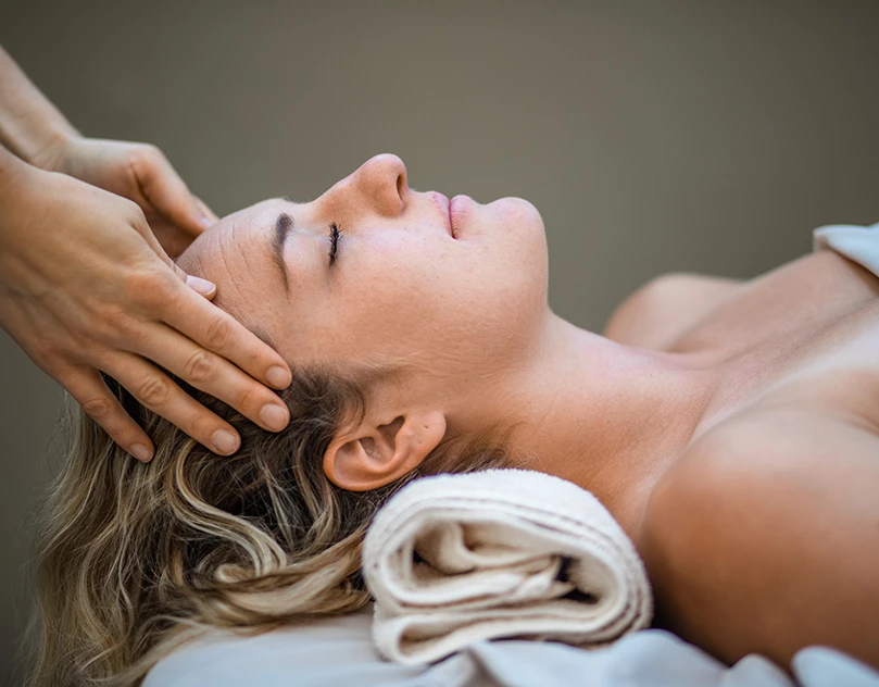 woman getting relaxing facial