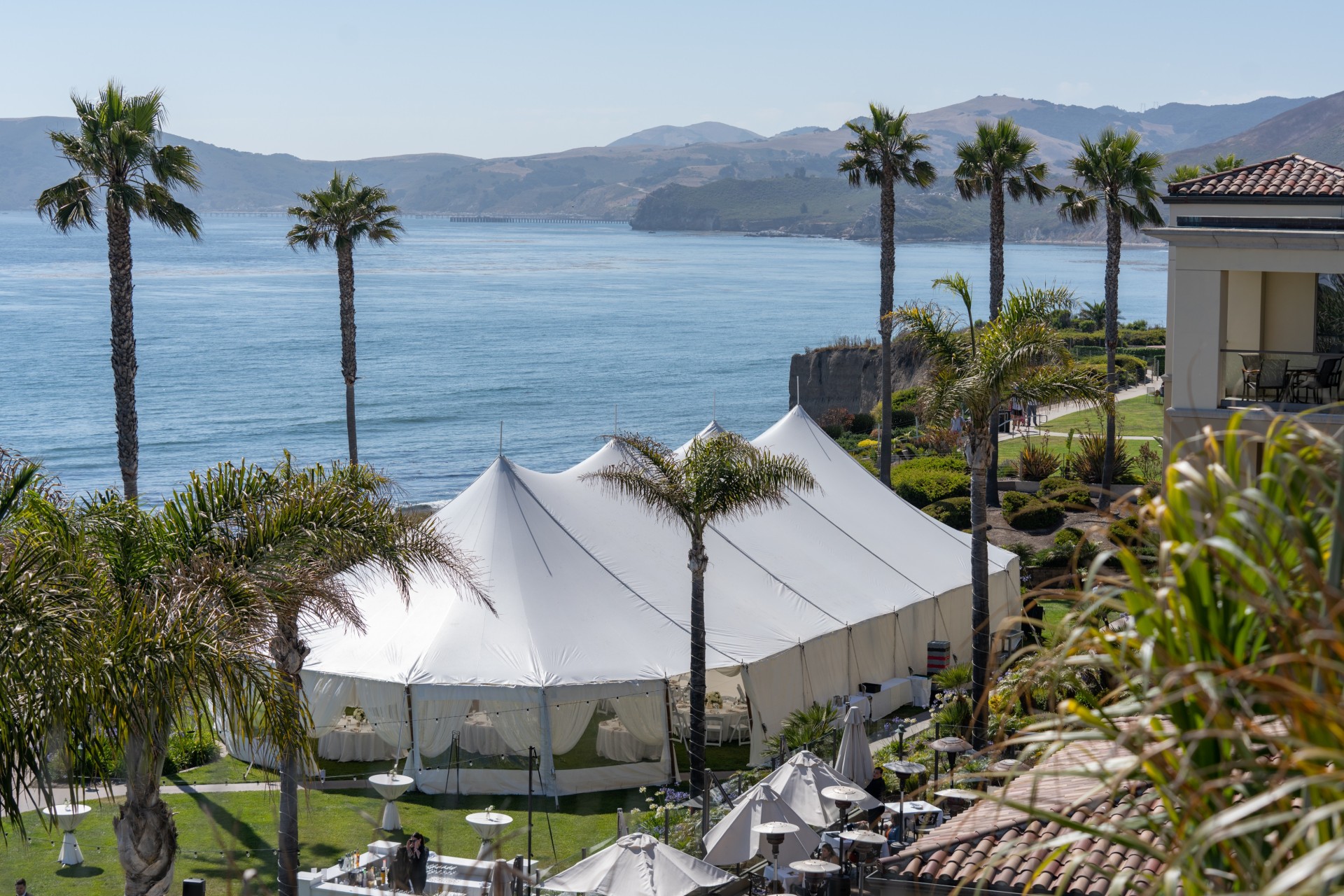 Aerial view of the Pacific View Tent at Dolphin Bay Resort & Spa in Pismo Beach — stunning oceanfront wedding venue showcasing the tented reception space right along the cliff with sweeping Pacific views.