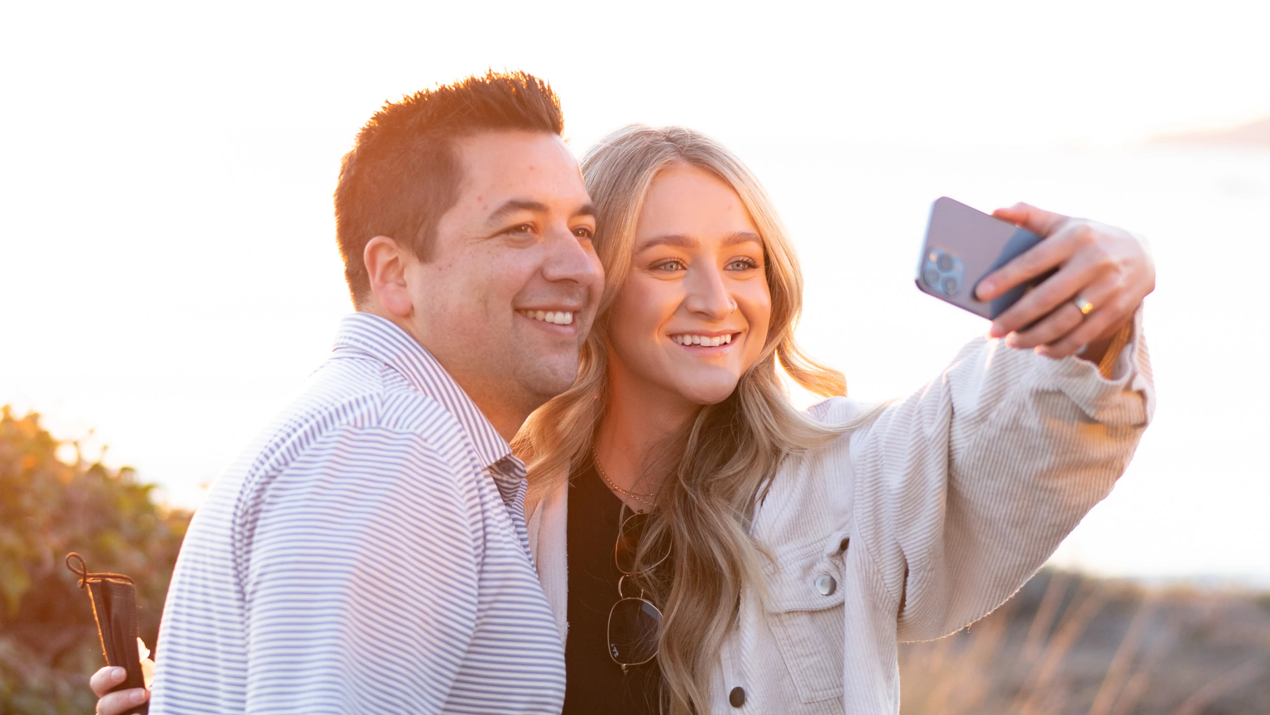 a man and woman taking a selfie