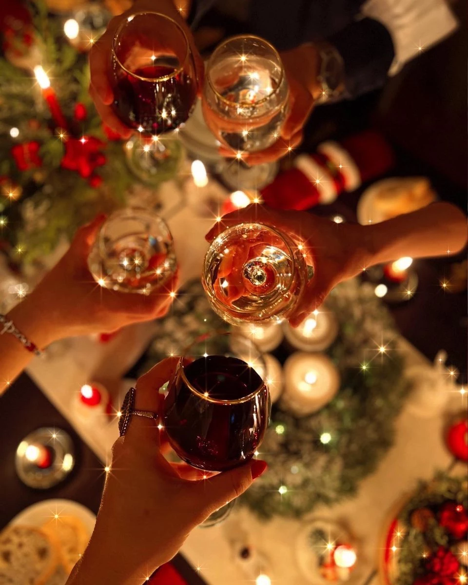 a group of people holding wine glasses
