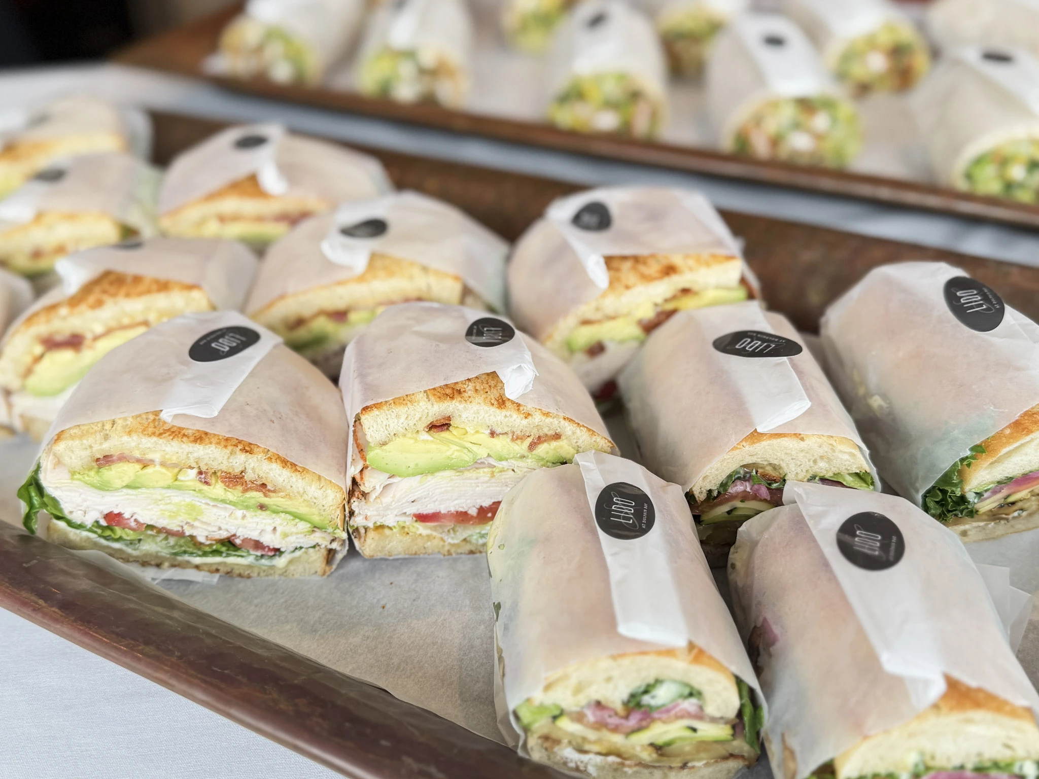 a tray of sandwiches on a table