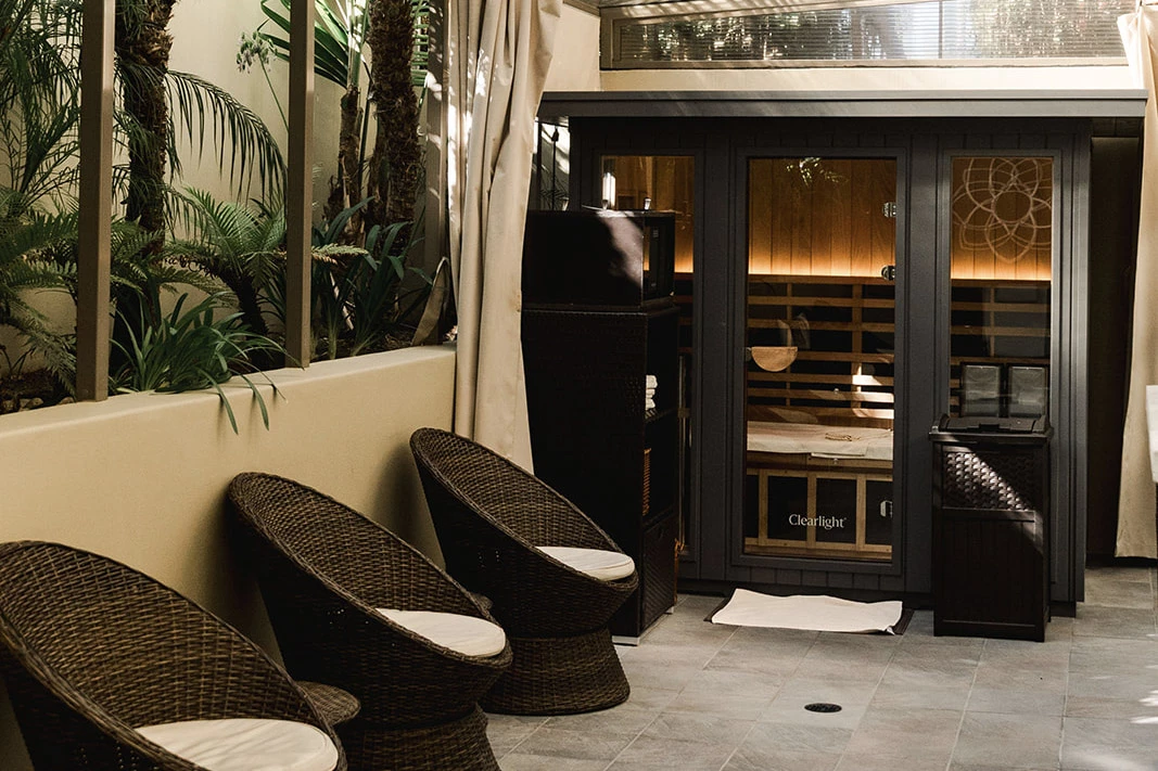 a room with chairs and a sauna