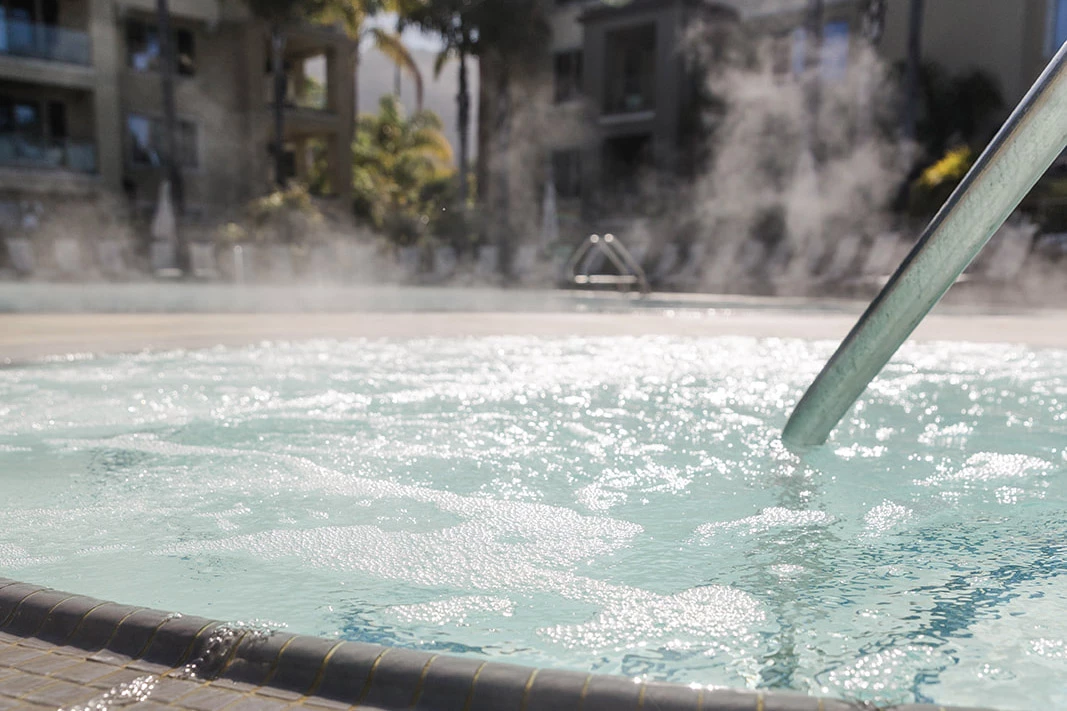 a hot tub with steam coming out of it