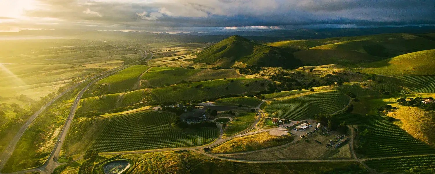 a aerial view of a green valley