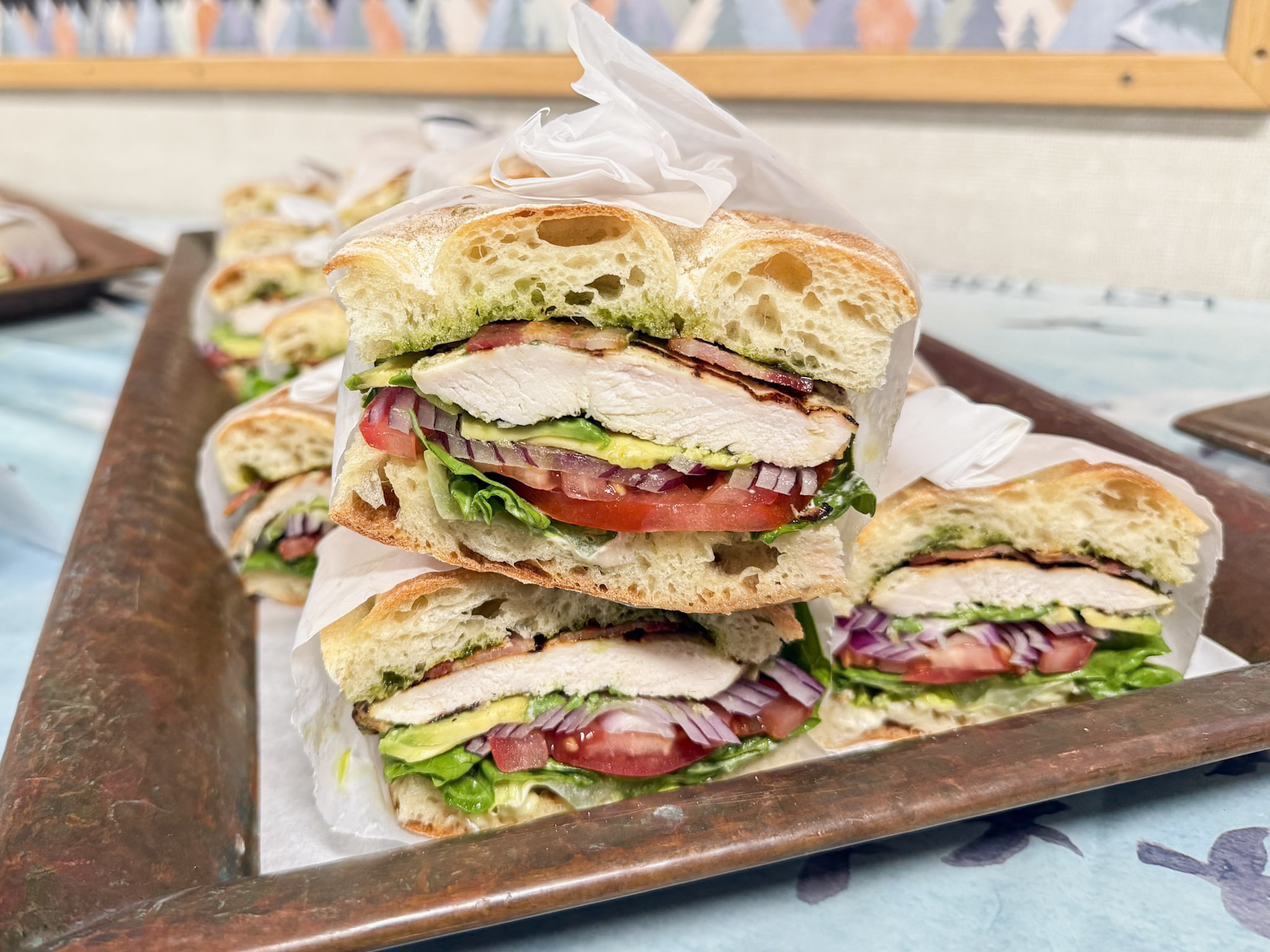 Fresh pesto chicken sandwiches prepared by the chefs at Lido Restaurant & Lounge — gourmet offsite catering from Dolphin Bay Resort & Spa in Pismo Beach.