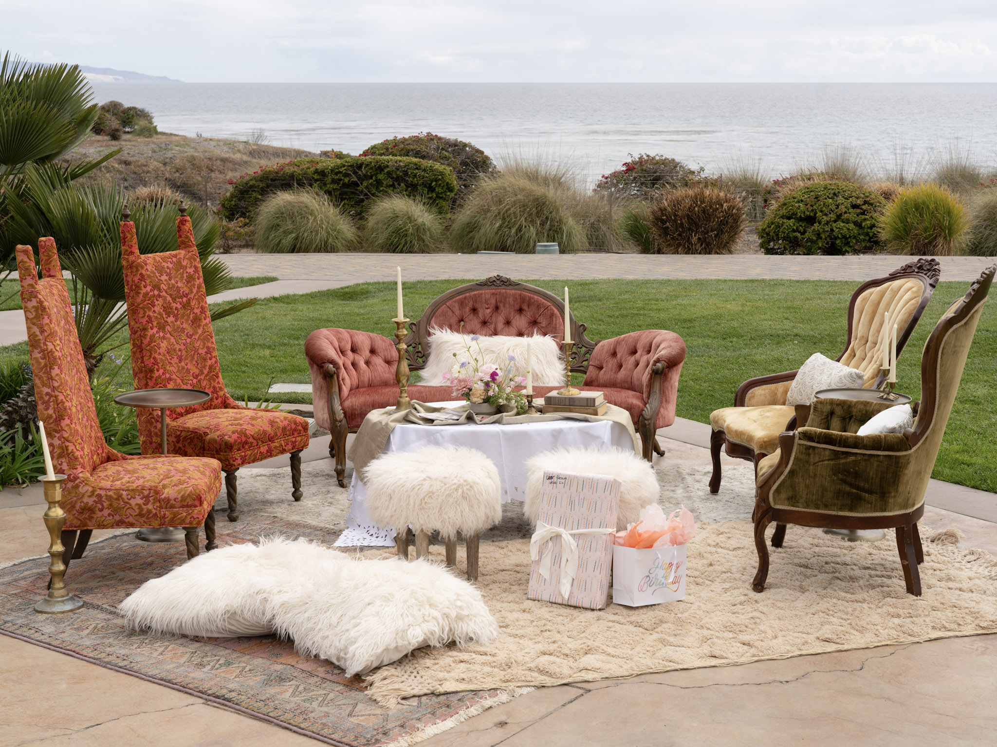 Cozy tea party lounge setup with couches, candles, rugs, and blankets for storytime with a princess at Dolphin Bay Resort & Spa — a magical experience for all ages.
