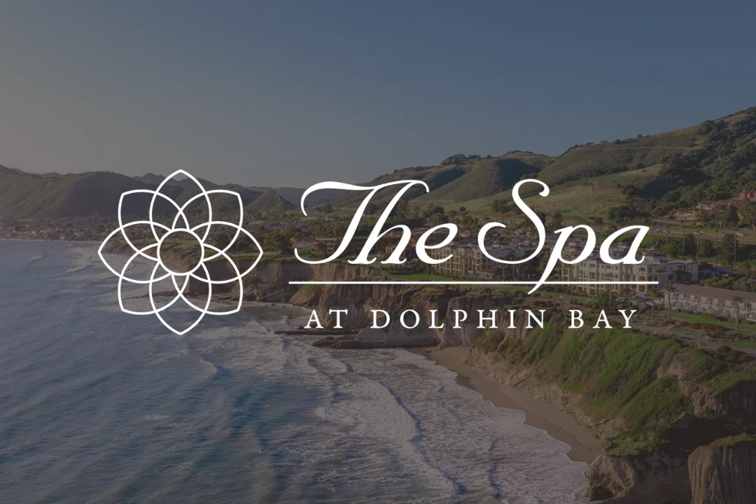 a beach with waves and hills