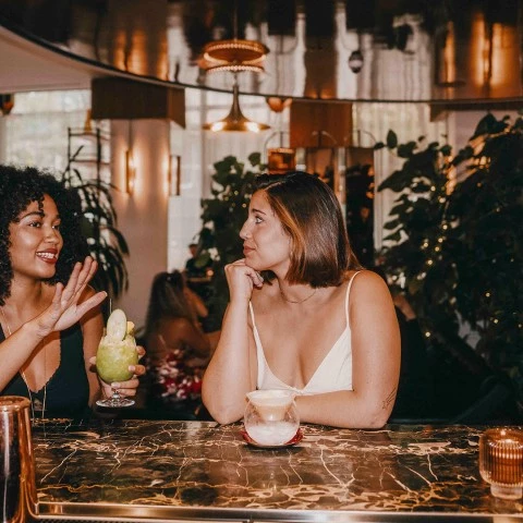 two women sitting at a table