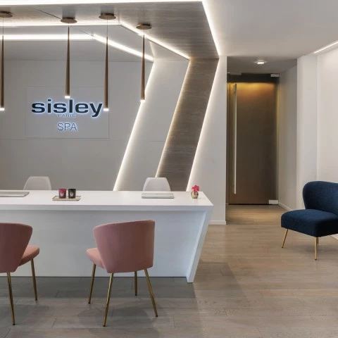 a room with a white table and chairs