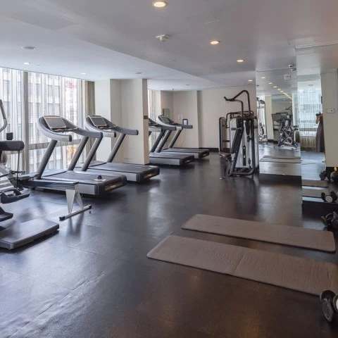 a gym with treadmills and exercise equipment
