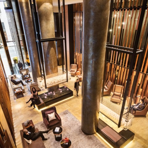 a high angle view of a lobby with people sitting on chairs