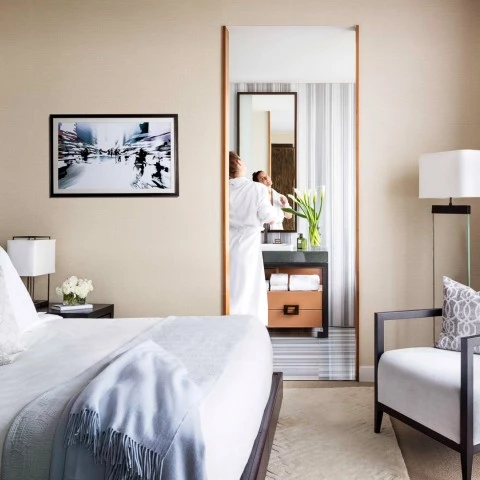 a person in a robe standing in a room