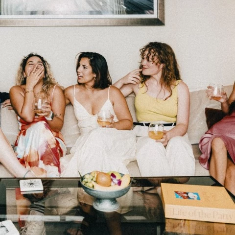 a group of women sitting on a couch