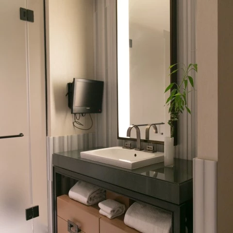 a bathroom with a mirror and sink