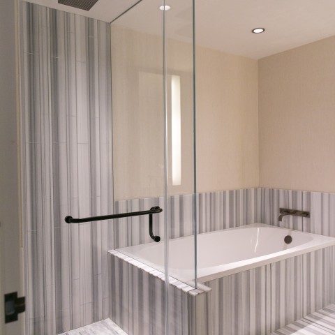 a bathroom with a glass shower door