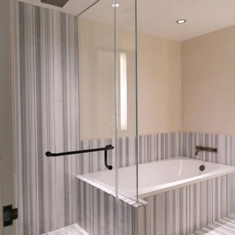a bathroom with a glass shower door