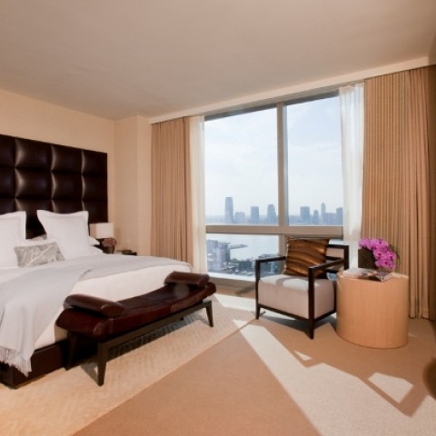 a bedroom with a large window