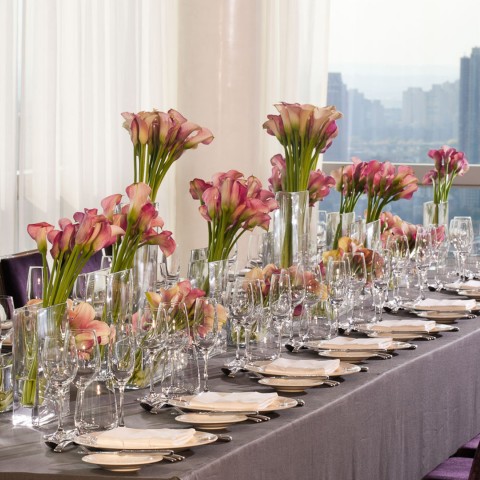 a table with flowers and plates