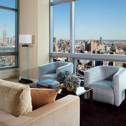 a living room with a view of a city