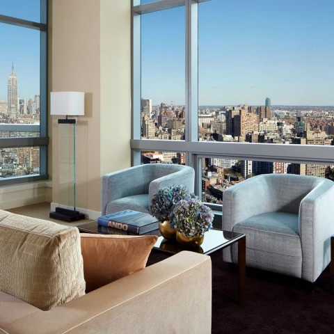 a living room with a view of a city