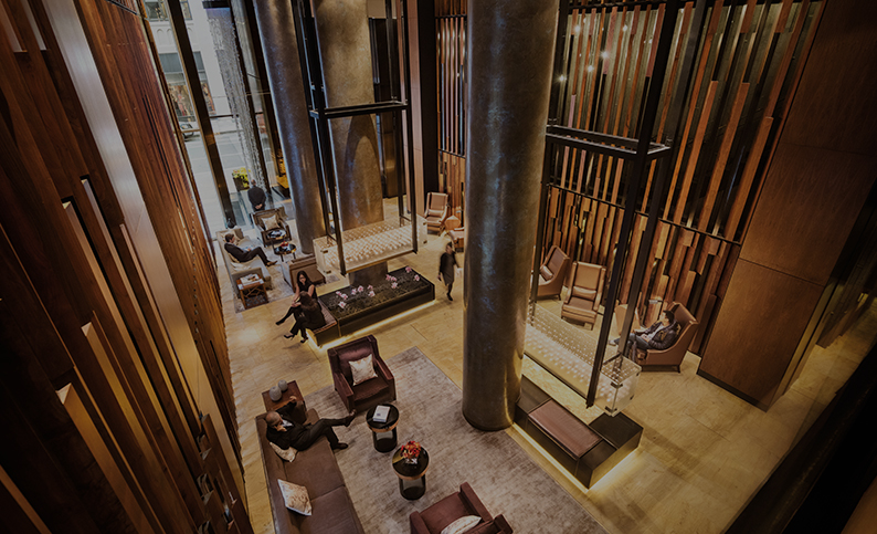 a group of people sitting in a lobby