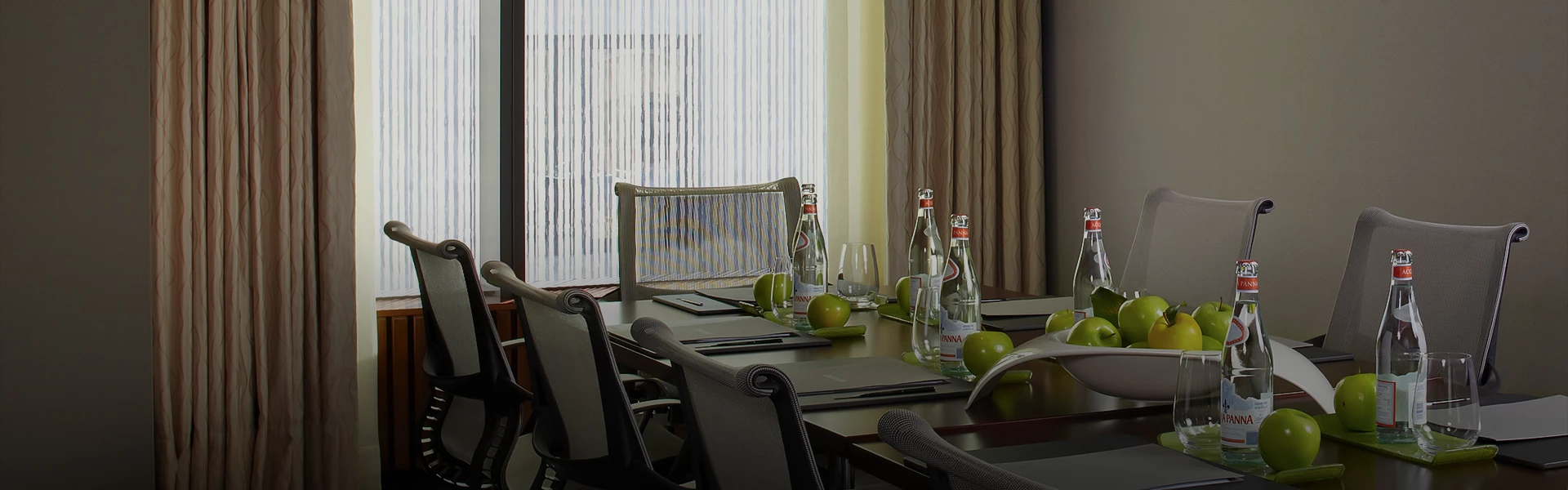 a dining table set for a meeting or event