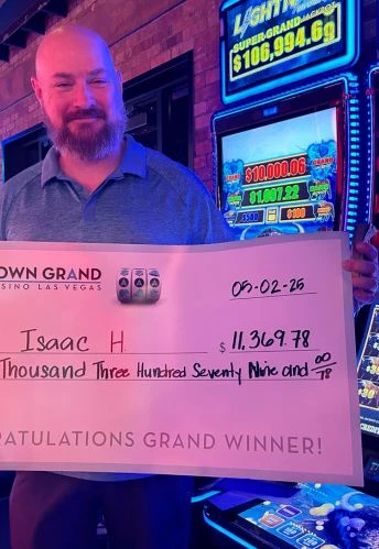 a man holding a check