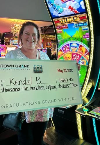 a woman holding a check