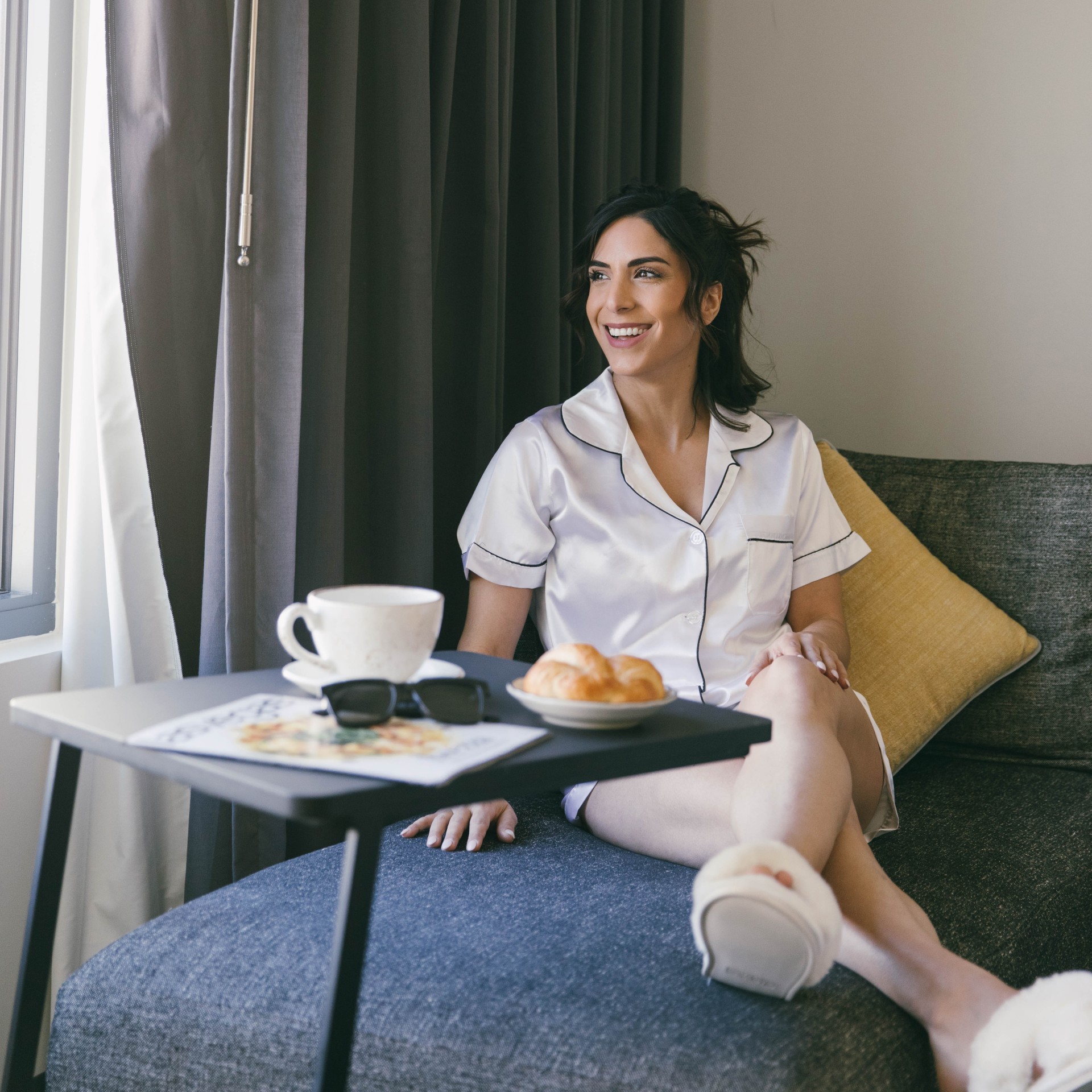 a woman sitting on a couch