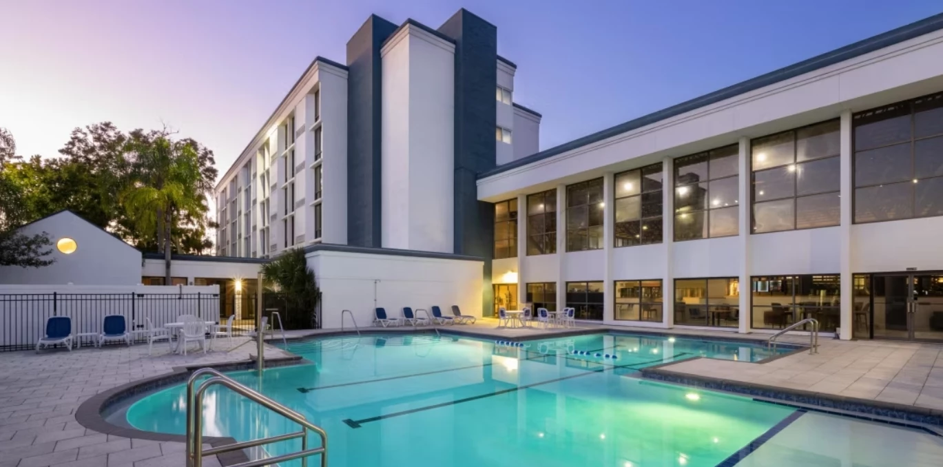 a swimming pool in front of a building
