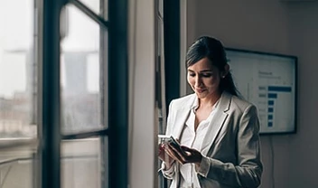 a woman looking at her phone